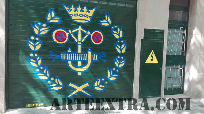 Parking decorado con logo Ingenieros Barcelona incorporando Prohibido Aparcar en graffiti por