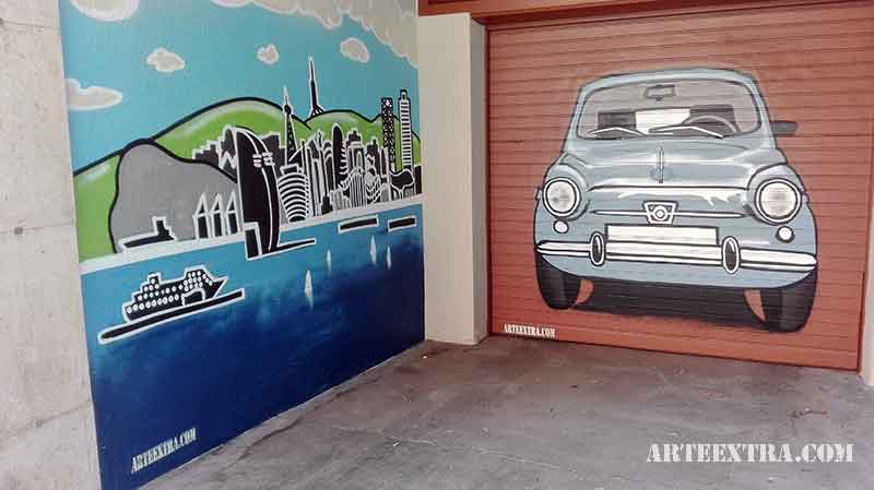 Puerta metálica y pared lateral parking decorada con 600 en espray graffiti Eixample Barcelona - ArteExtra
