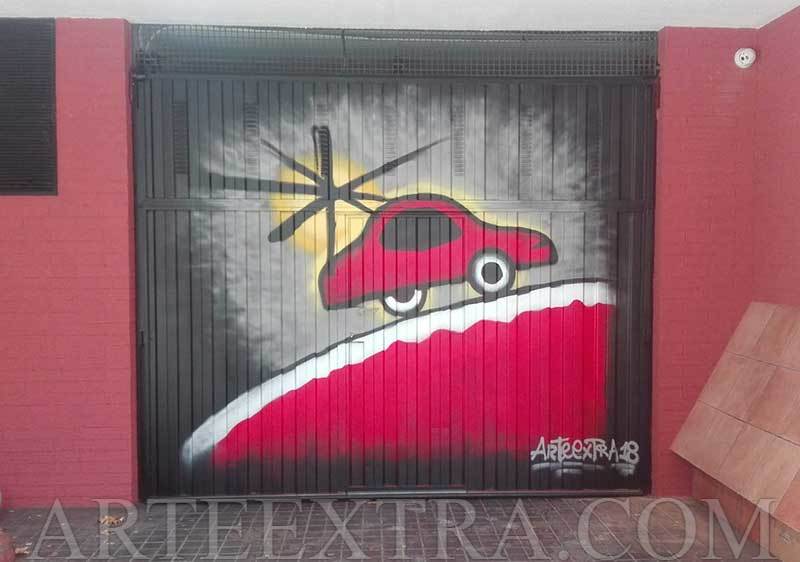 Decoración puerta parking en graffiti inspiración Miró   realizado por ArteExtra